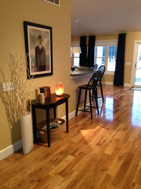 Character Honey Rose White Oak flooring with a semi-gloss finish in an open entryway and kitchen area.