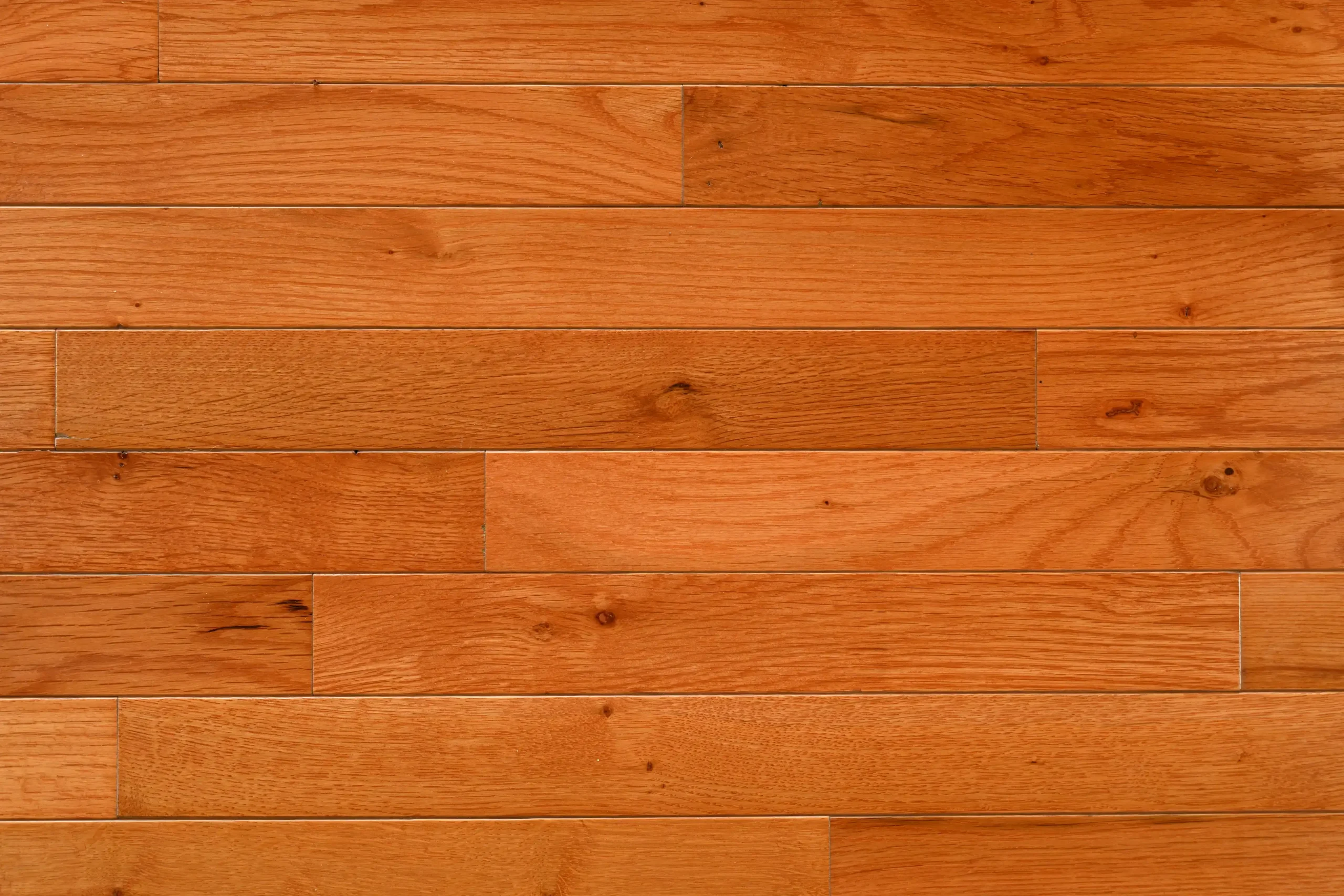 Character White Oak Gunstock Character grade White Oak hardwood flooring with a Gunstock stain and micro-bevel edges.