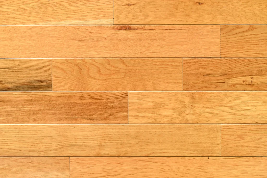 Character grade Honey Rose White Oak prefinished hardwood flooring with micro-bevel edges and natural wood grain.