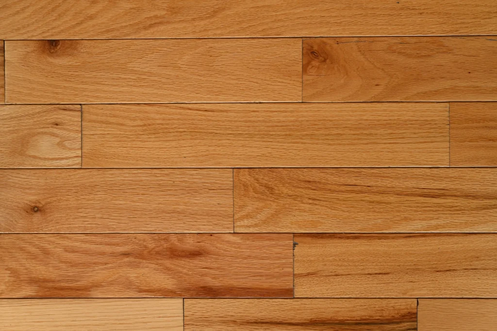 Natural Red Oak prefinished hardwood flooring in Character grade featuring micro-bevel edges and visible knots.