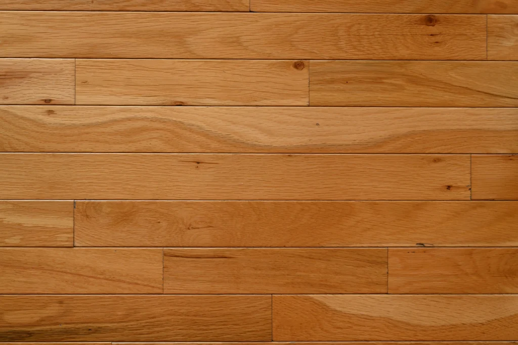 Character grade Natural White Oak prefinished hardwood flooring with micro-bevel edges and visible wood grain.