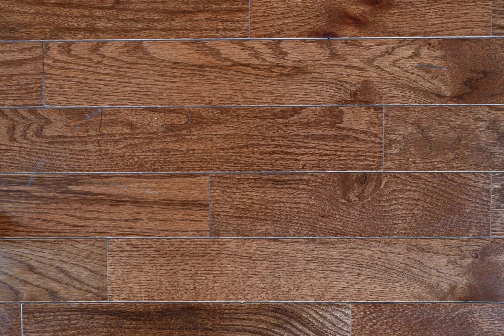Character grade Warm Walnut Red Oak prefinished hardwood flooring with micro-bevel edges.