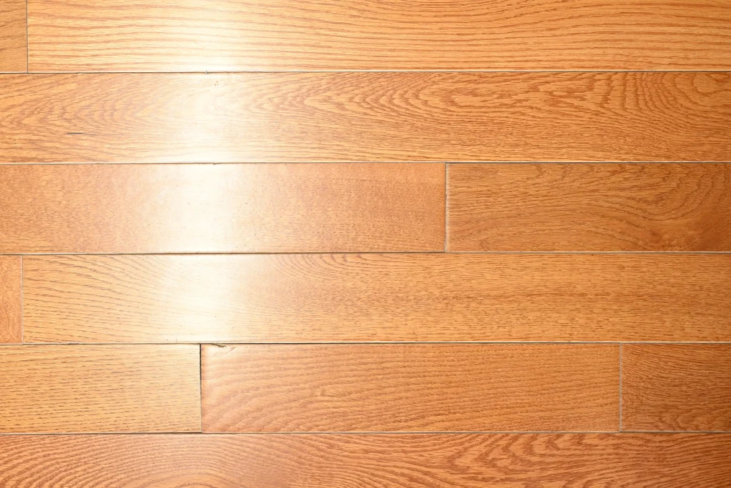 Choice grade Gunstock White Oak prefinished hardwood flooring with a low gloss satin finish and micro-bevel edges