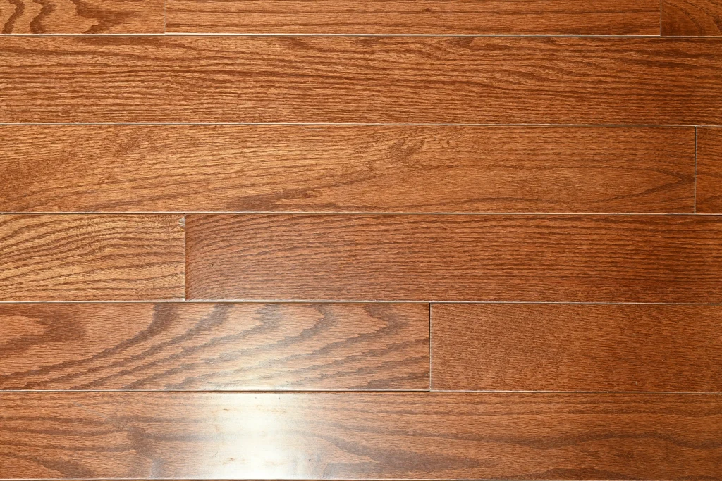 Choice grade Warm Walnut Red Oak prefinished hardwood flooring with micro-bevel edges and a professional protective finish.