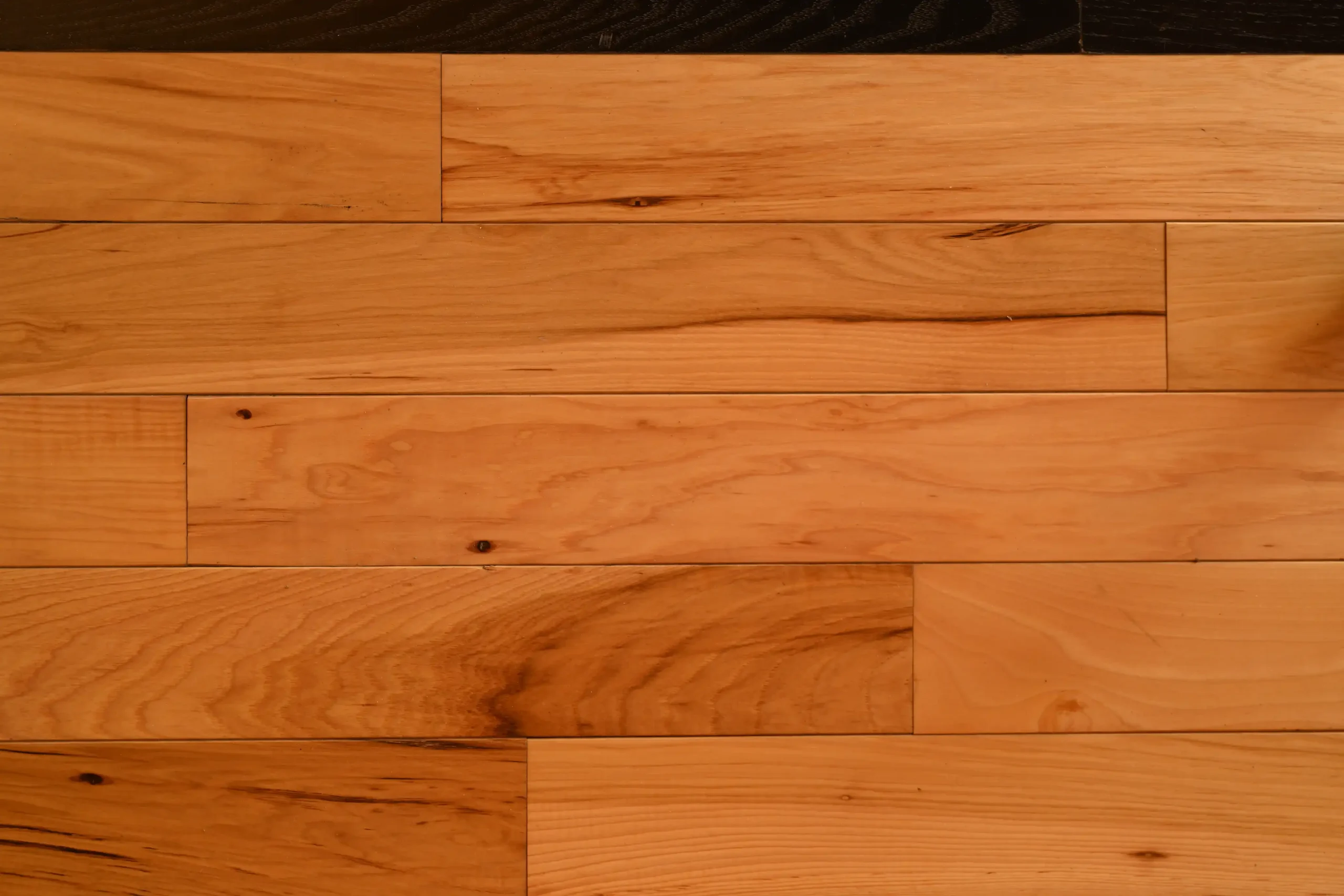 Natural Hickory Mill Run Natural Hickory prefinished hardwood flooring with micro-bevel edges and a clear protective finish.