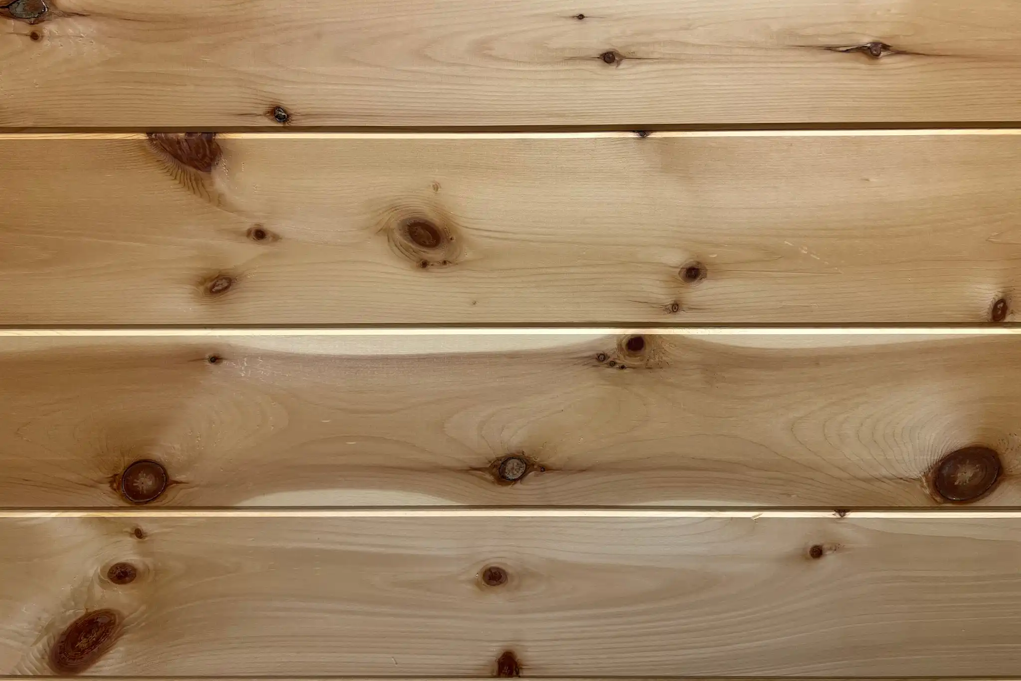 eastern-white-pine-wall-planks-virginia-appalachian-wood-tongue-groove-flat-side-scaled Flat-side Eastern White Pine tongue-and-groove wall planks made from Virginia Appalachian wood, showing natural knots and grain variation.